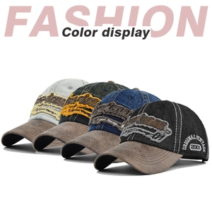 Detail of four vintage embroidered baseball caps with distressed fabric and leather brims
