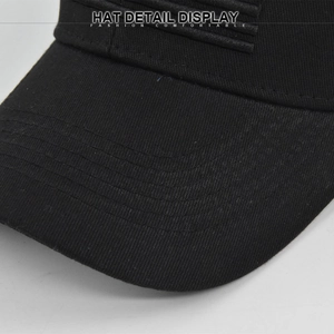 Detailed close-up of a black baseball cap featuring durable six-row brim stitching
