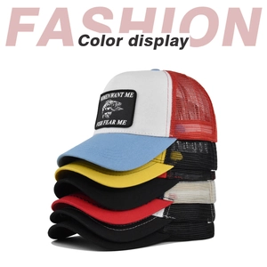 Vertical stack of colorful mesh trucker hats featuring custom fish embroidery patches