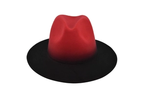 Detailed close-up showing the red and black gradient texture of the wool fedora hat