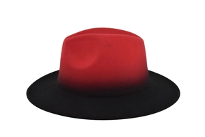Detail of red and black gradient fedora hat with wide brim made of premium wool felt