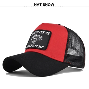 Detail of red and black trucker hat with breathable mesh and fishing themed embroidery