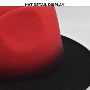 Detailed macro view showing the red and black gradient wool texture of the jazz fedora hat