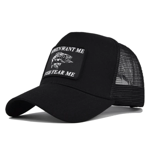 Detail of black trucker hat with mesh back and embroidered fishing patch design