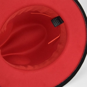 Detail view of red and black felt fedora interior with adjustable strap and cotton blend fabric