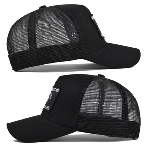 Close-up of mesh trucker hat featuring Want Me Fear Me embroidered patch on black crown