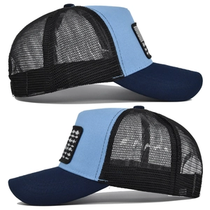 Dettaglio del cappello trucker tricolore con ricamo a lisca di pesce e rete traspirante