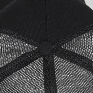 Detailed top view of black mesh baseball cap with high-quality stitching and fabric button