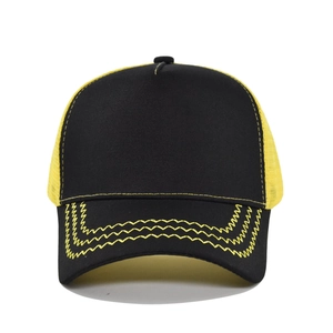 Detail of black baseball cap featuring yellow mesh back and wavy decorative stitching