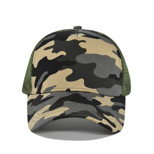 Detailed view of the jungle camouflage pattern and breathable green mesh of the trucker hat