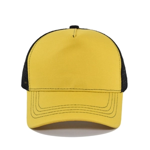 Detail view of yellow and black two-tone trucker hat with breathable mesh and curved brim