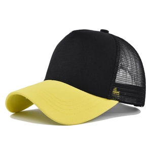 Detail of black trucker hat with yellow visor and breathable mesh back panel