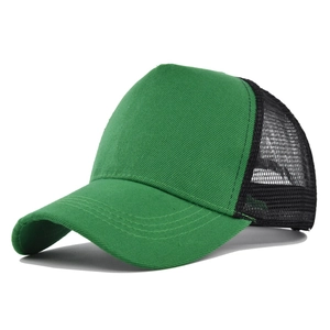Detail view of the green cotton brim and breathable black nylon mesh of the trucker hat