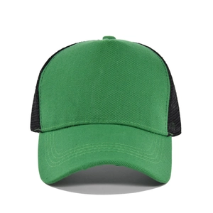 Detail of green cotton twill brim and breathable black mesh back on trucker hat