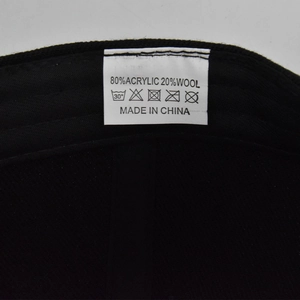 Detail of product care label showing 80% acrylic and 20% wool fabric composition