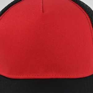 Detail of red and black trucker hat with breathable mesh and premium stitching