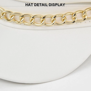 White wool baker boy hat with a chunky gold metal chain detail and leather texture
