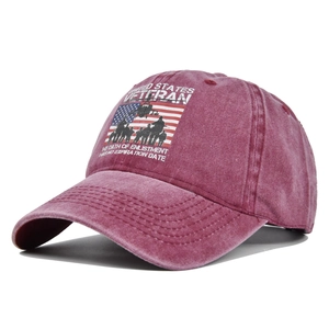 Detail of vintage washed wine red cotton baseball cap with United States Veteran print