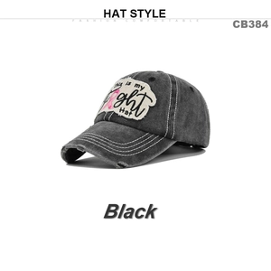 Detail of distressed dark grey baseball cap with This is my fight embroidered patch