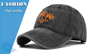 Detail view of the orange coconut tree embroidery on a vintage charcoal baseball cap