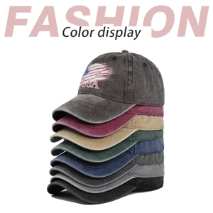 Vertical stack of retro washed cotton baseball caps with USA embroidery in seven colors