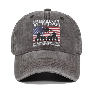 Close-up of distressed charcoal baseball cap with veteran print and helicopter graphic