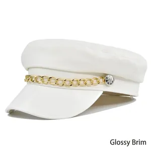 White faux leather newsboy cap with gold chain accent and glossy brim shown in 45-degree view