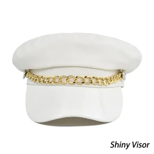 White Baker Boy hat featuring a glossy brim and decorative gold metal chain on front