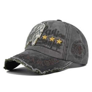 Detailed close-up of distressed cotton fabric with Fashion embroidery and 1988 patch