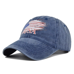Close-up detail of vintage washed navy denim fabric with USA logo on baseball cap