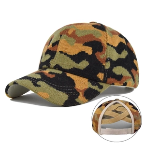 Detail of forest camo knit ponytail baseball cap featuring elastic criss-cross back straps
