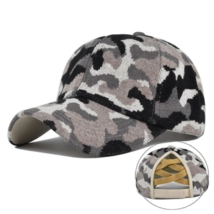 Detail view of camouflage knit baseball cap with elastic ponytail hole in the back