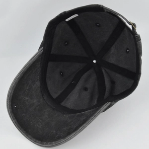 Inside view of grey washed cotton baseball cap showing 100% cotton label and stitching