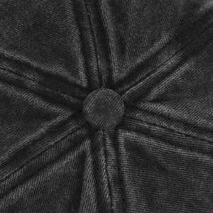 Macro shot of corduroy baseball cap crown with fabric-covered button and stitching