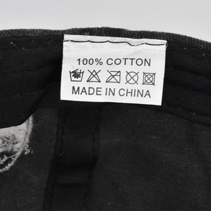 Macro shot of 100% cotton washing label and inner stitching on vintage baseball cap
