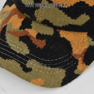 Detail view of camouflage knit hat showing reinforced stitching and coarse fabric texture
