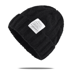 Classic black cable-knit beanie with stylish textile label and warm folded cuff design