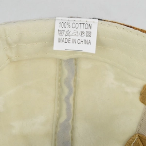 Close-up of ponytail knit hat interior with 100% cotton label and fine stitching