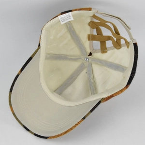 Detail view of cotton ponytail baseball cap with interior lining and elastic cross bands