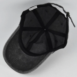 Detailed interior of a charcoal grey washed cotton baseball cap with adjustable metal buckle