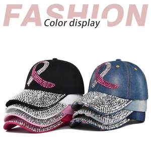 Detail display of multiple rhinestone baseball caps featuring symbolic ribbon embroidery