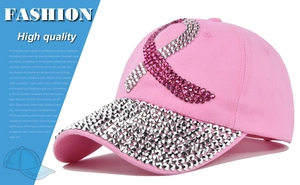 Detail view of pink baseball cap with sparkling rhinestones in a ribbon pattern
