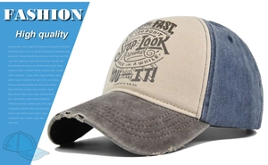 Detailed view of vintage patchwork baseball cap with graffiti print and distressed holes