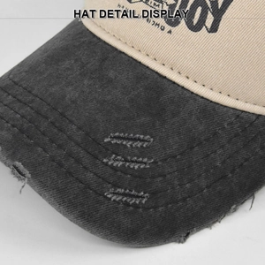 Detail showing distressed edges and graffiti print on a vintage baseball cap