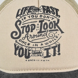 Distressed graffiti baseball cap in beige and dark grey with vintage text print
