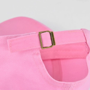 Detail of pink baseball cap adjustable copper buckle and high-quality stitching