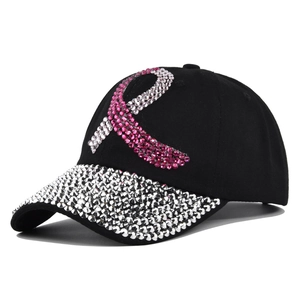 Black baseball cap with silver rhinestones on brim and pink ribbon motif for awareness