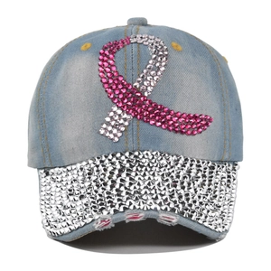 Close-up of pink and silver rhinestones on a washed denim baseball cap with ribbon motif