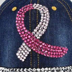 Denim baseball cap with pink rhinestone breast cancer ribbon pattern and glitter details