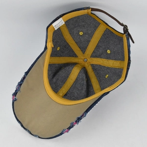 Internal view showing 100% cotton lining and distressed brim of the denim baseball cap